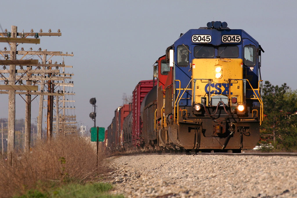 CSX 8045 and BNSF 151
While driving through Jenison, heard the detector in Zeeland go off, and I knew I'd get to meet a train, probably Q326.  Found them on the west end of Hudsonville, pulled off and captured this:  Q326 with CSX 8045 and BNSF 151.  04/27/06
