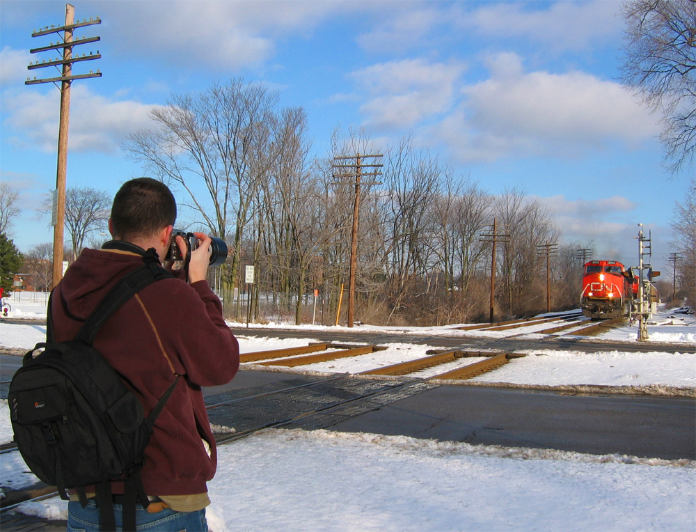 Our Fearless Leader
Zack snaps pictures of CN 397, as it approaches Harrison Road in East Lansing.
1/21/06
