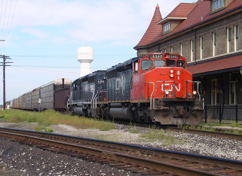 CN 5340 End Switch
CN 5340 heads across the diamonds at Durand after interchanging cars in the yard to the north.  It will soon back out to the west to gather the rest of its train and head down the Holly Sub toward Pontiac.  09/27/07
