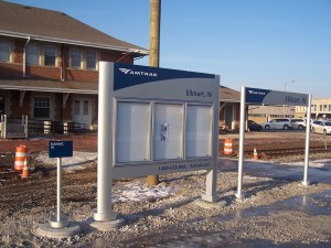 The new signs at the east walkway. Note the smallest sign (&quot;Elkhart, IN&quot;) is on the larger size base. The small sign has raised letters and braille - but one must walk off of the platform to touch it.