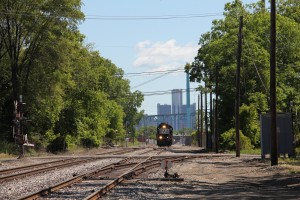 NS 1628 slowly makes its way westbound near McKinstry Street as viewed from the crossing at Junction Avenue. Detroit landmarks in the distance set the scene. Once upon a time, this was where the Pere Marquettes, Sportsman, Red Arrow and Wabash Cannonball clicked off their final couple miles before arriving at Fort Street Union Depot.